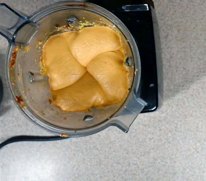 Overhead view of the blender with cheese mixture blended.