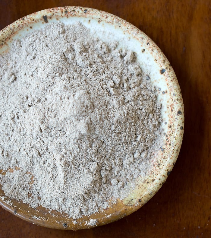 teff flour Brown Teff Flour on a brown pottery plate