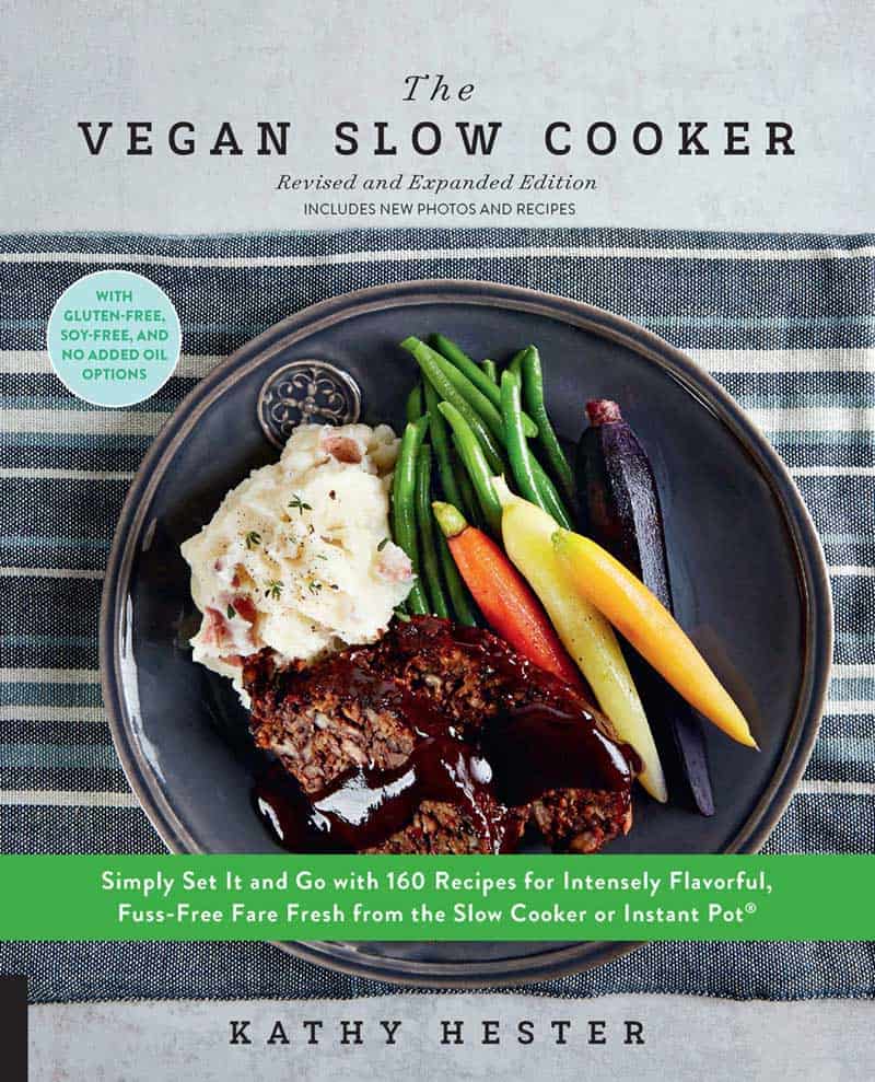 Kathy Hester's book front cover page of The Vegan Slow Cooker Revised and Expanded Edition with a healthy ceramic bowl of vegan recipe