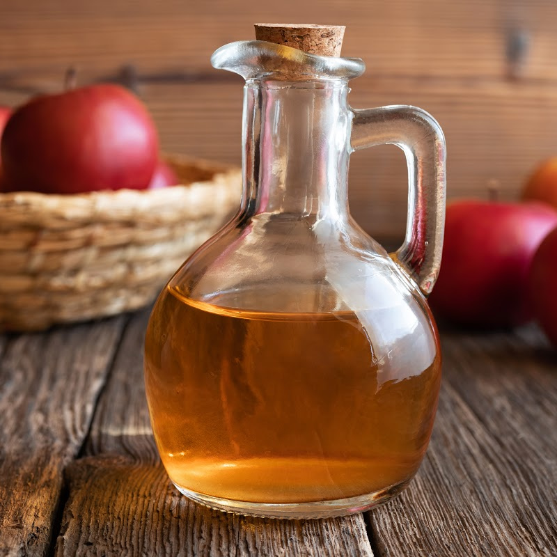Apple Cider Vinegar with apples in basket